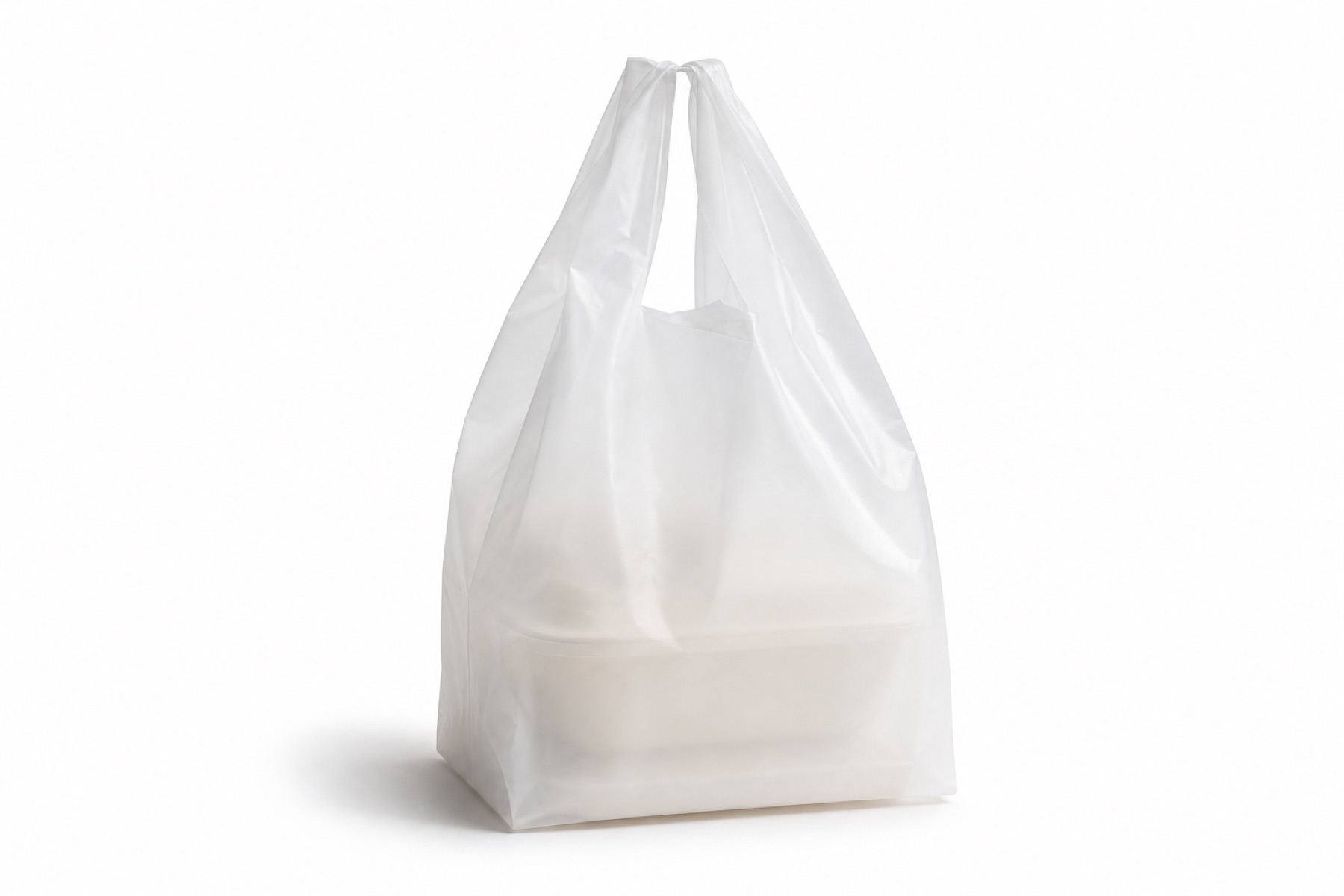 A translucent frosted-white compostable takeaway bag with twist handles, holding a faintly visible takeout container, on white.